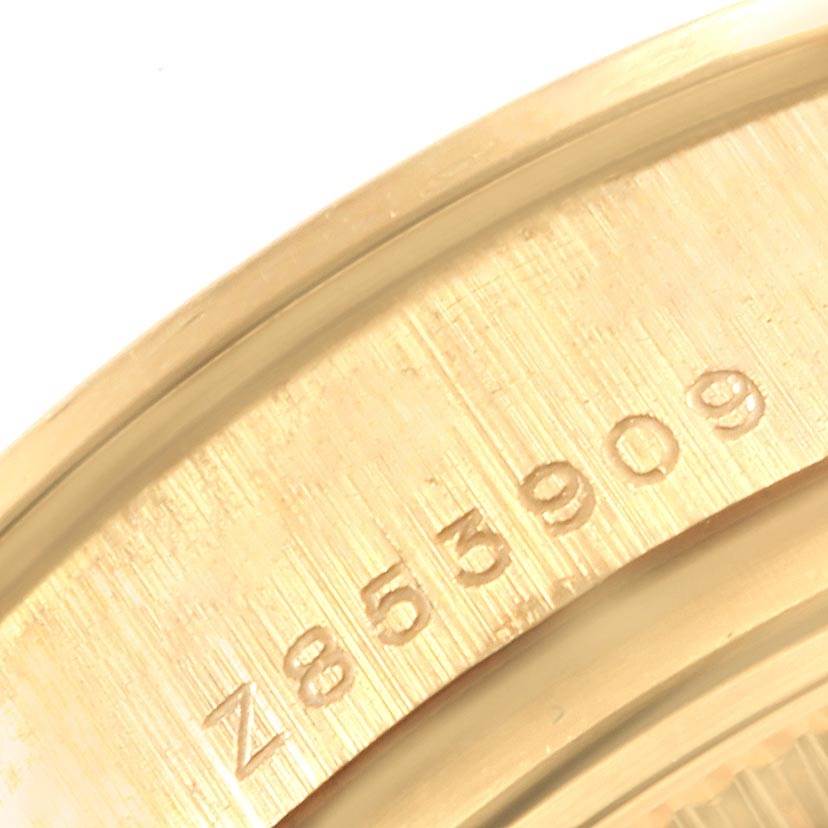 This close-up image shows the engraved serial number inside the case of a Rolex President 179138 Women's Yellow Gold Mother of Pearl Dial 179138 Women's Yellow Gold Mother of Pearl Dial model watch.