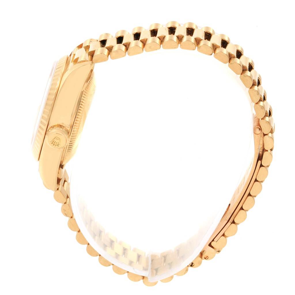 The image shows a side view of the Rolex President 69178 Women
s Yellow Gold Silver Dial 69178 Women
s Yellow Gold Silver Dial model watch, highlighting its gold case and bracelet.