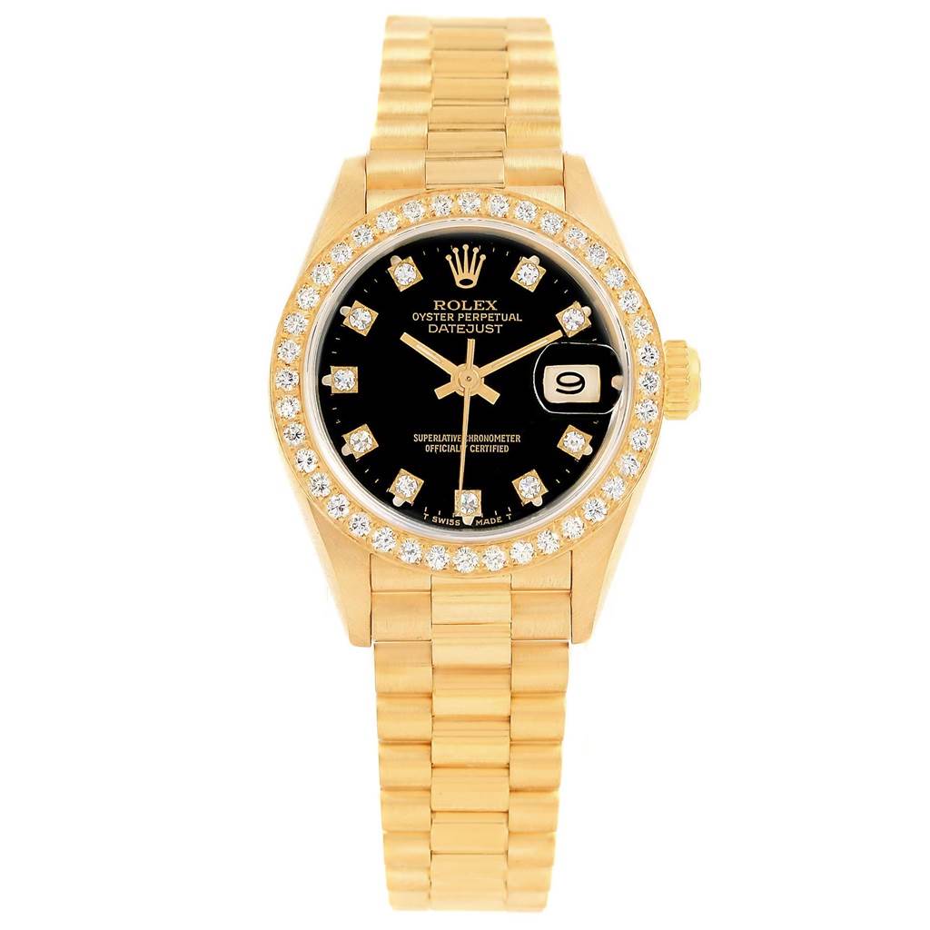 The image shows a Rolex President 69138 Women's Yellow Gold Black Dial 69138 Women's Yellow Gold Black Dial model watch from a frontal angle, highlighting its gold bracelet, black dial, and diamond bezel.