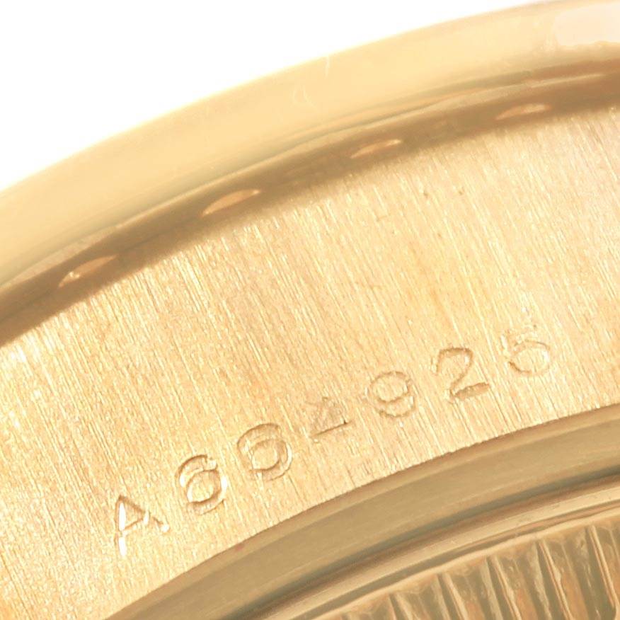 The image shows a close-up of the case back of a Rolex President 79138 Women's Yellow Gold Mother of Pearl Dial 79138 Women's Yellow Gold Mother of Pearl Dial model watch, focusing on the serial number engraving.