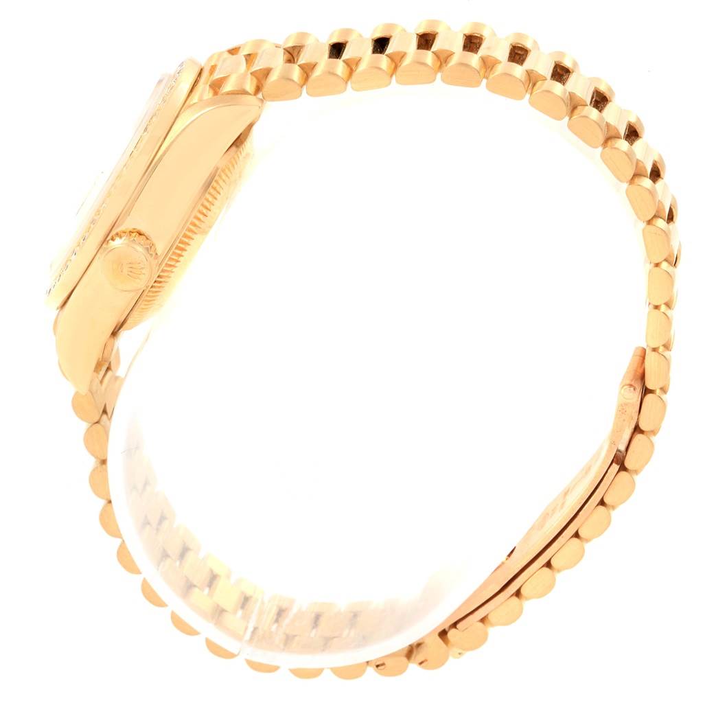 The image shows a side view of a Rolex President 69178 Women
s Yellow Gold Champagne Dial 69178 Women
s Yellow Gold Champagne Dial model watch, highlighting the gold bracelet and crown.