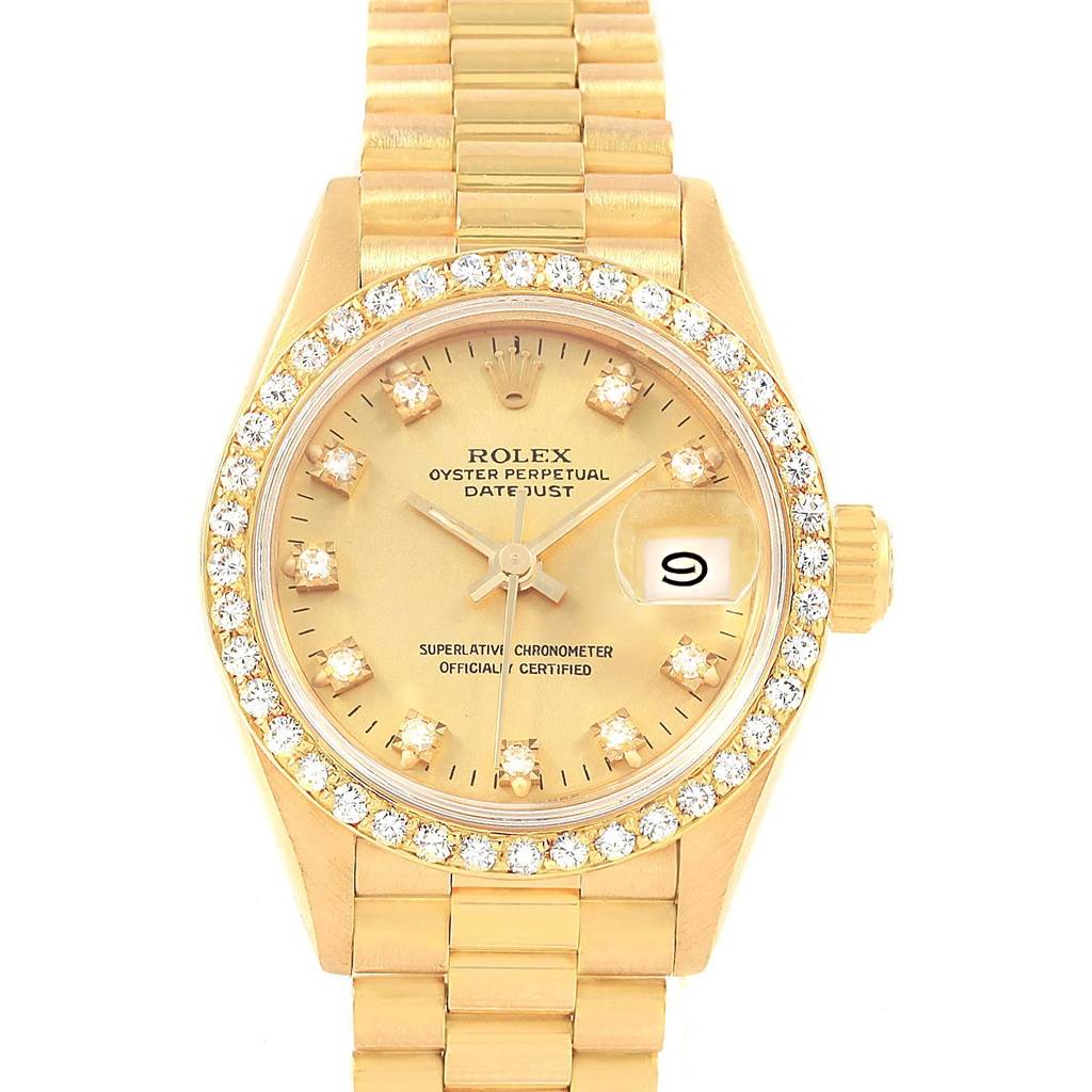 The image shows a front view of a Rolex President 69178 Women
s Yellow Gold Champagne Dial 69178 Women
s Yellow Gold Champagne Dial model Datejust watch, highlighting its diamond-embellished bezel and bracelet.