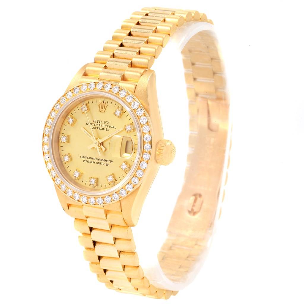 This image shows a Rolex President 69178 Women
s Yellow Gold Champagne Dial 69178 Women
s Yellow Gold Champagne Dial model watch angled to display the face, bracelet, and diamond-encrusted bezel.