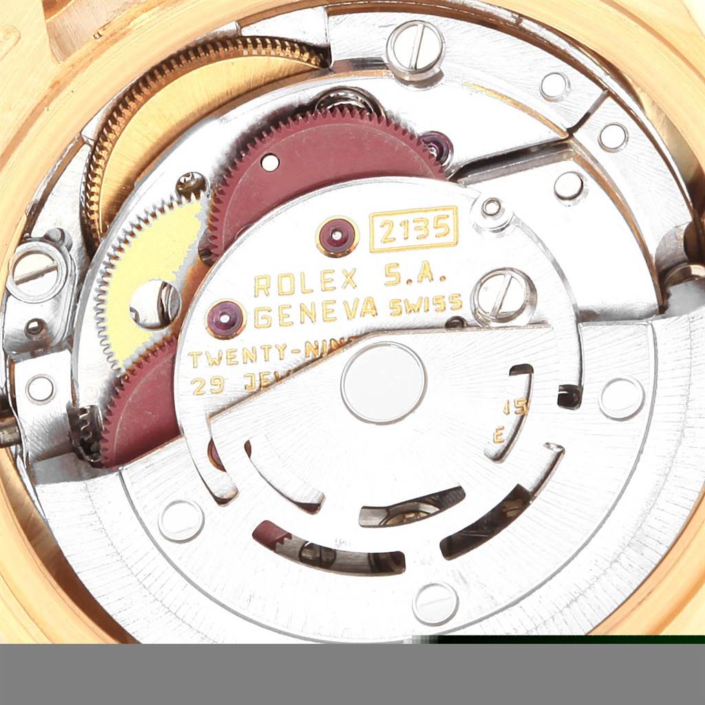 This image shows the inner movement mechanism of a Rolex President 69178 Women
s Yellow Gold Champagne Dial 69178 Women
s Yellow Gold Champagne Dial model watch, highlighting its gears and intricate components.