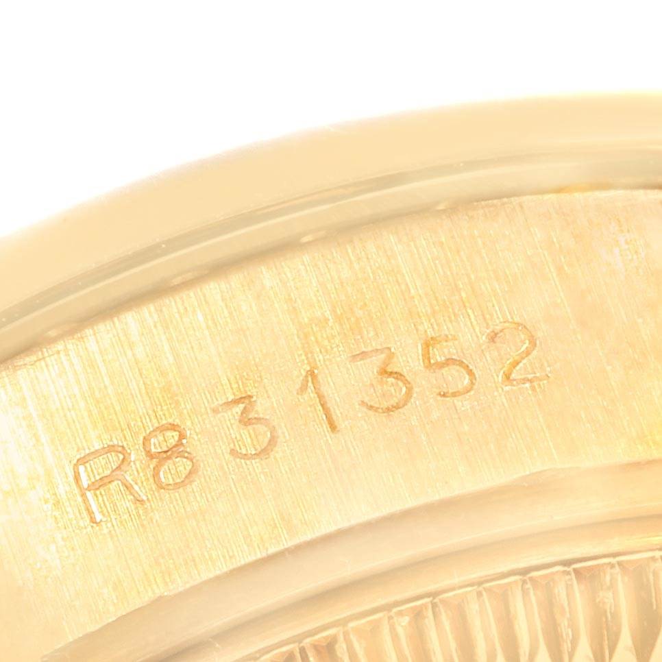 This close-up shows the engraved serial number on the inner bezel of a Rolex President 69178 Women
s Yellow Gold Champagne Dial 69178 Women
s Yellow Gold Champagne Dial model watch.