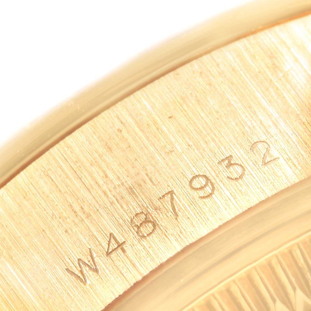 This image shows a close-up of the serial number engraved on the gold casing of a Rolex President 69178 Women
s Yellow Gold Champagne Dial 69178 Women
s Yellow Gold Champagne Dial model watch.
