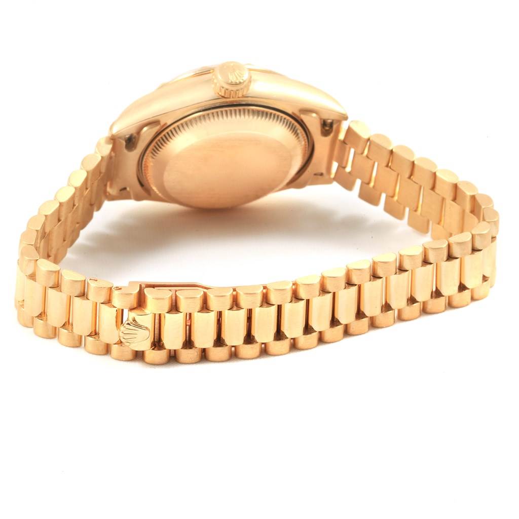 This image shows the back, crown, and bracelet of a Rolex President 69178 Women
s Yellow Gold Champagne Dial 69178 Women
s Yellow Gold Champagne Dial model watch.