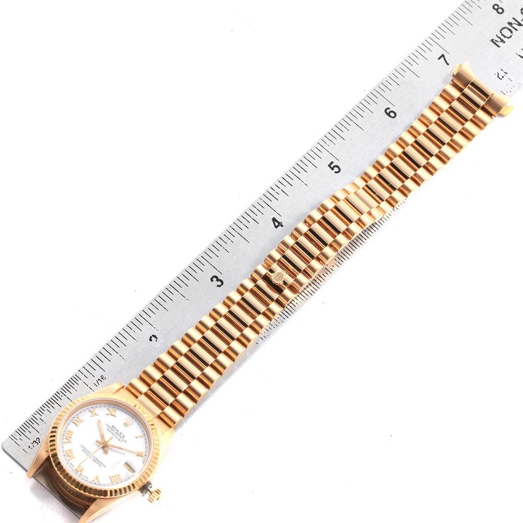 The image shows a Rolex President 68278 Women's Yellow Gold White Dial 68278 Women's Yellow Gold White Dial model watch, lying flat with its face and entire bracelet displayed alongside a ruler.