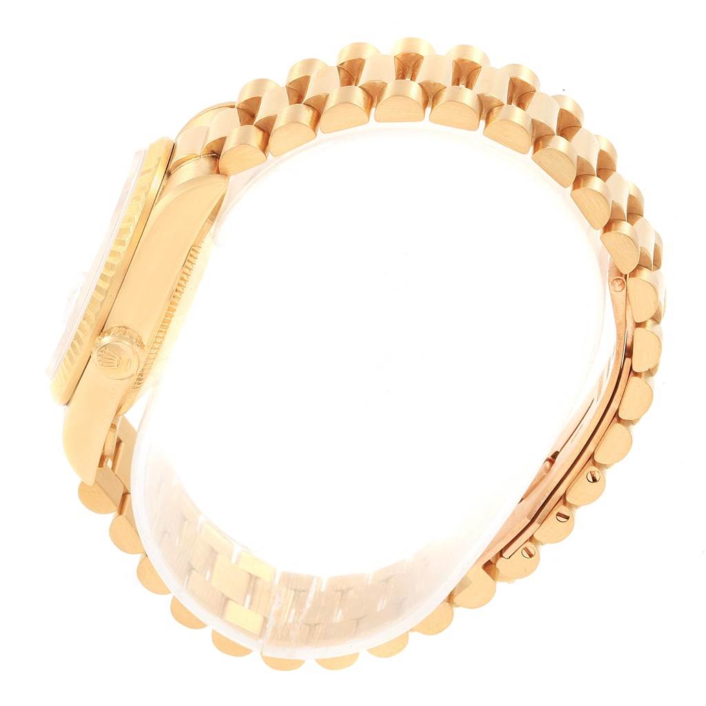 The image shows a side view of a Rolex President 68278 Women's Yellow Gold White Dial 68278 Women's Yellow Gold White Dial model watch with focus on its gold bracelet and case.