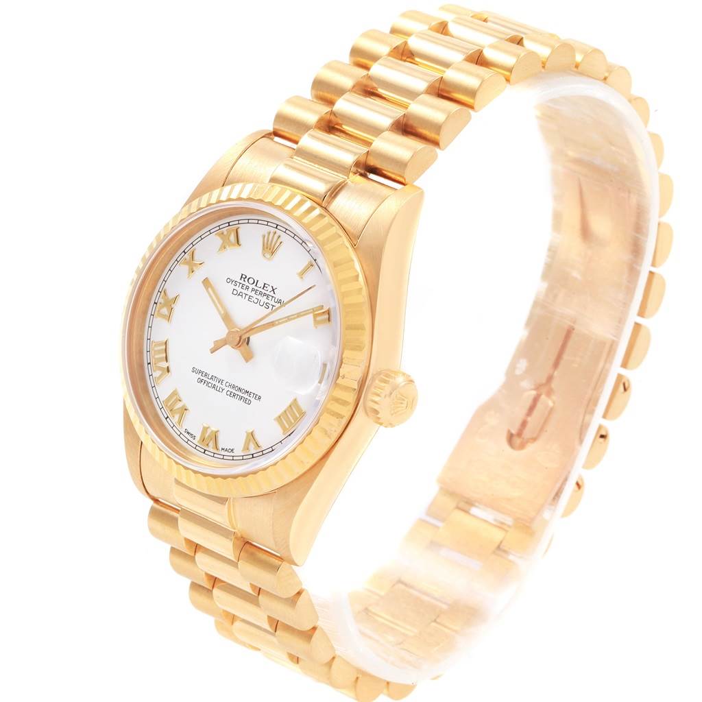 The Rolex President 68278 Women's Yellow Gold White Dial 68278 Women's Yellow Gold White Dial model watch is shown at a tilted angle, displaying its gold band, white dial, and fluted bezel.