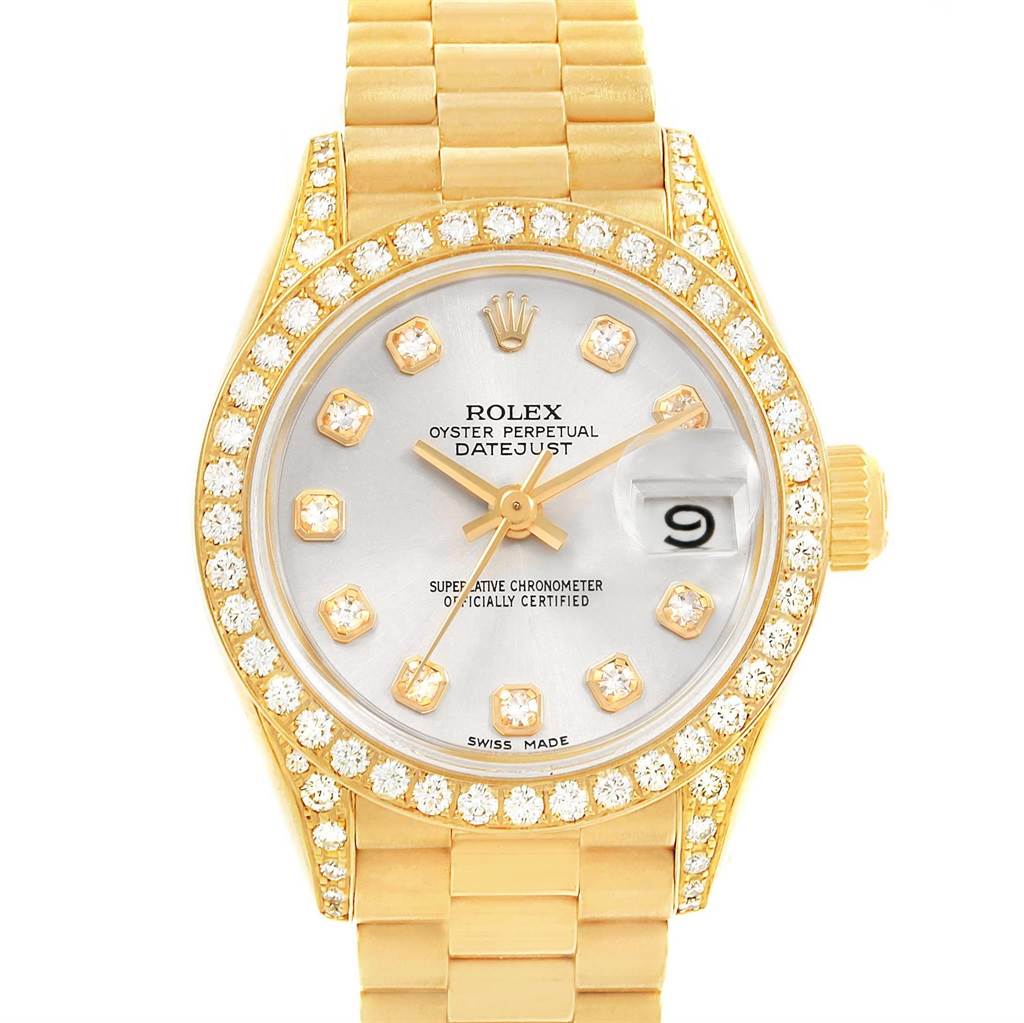 The Rolex President 69158 Women's Yellow Gold Silver Dial 69158 Women's Yellow Gold Silver Dial model watch is shown from a front angle, displaying its gold bracelet, diamond bezel, and dial with date function.