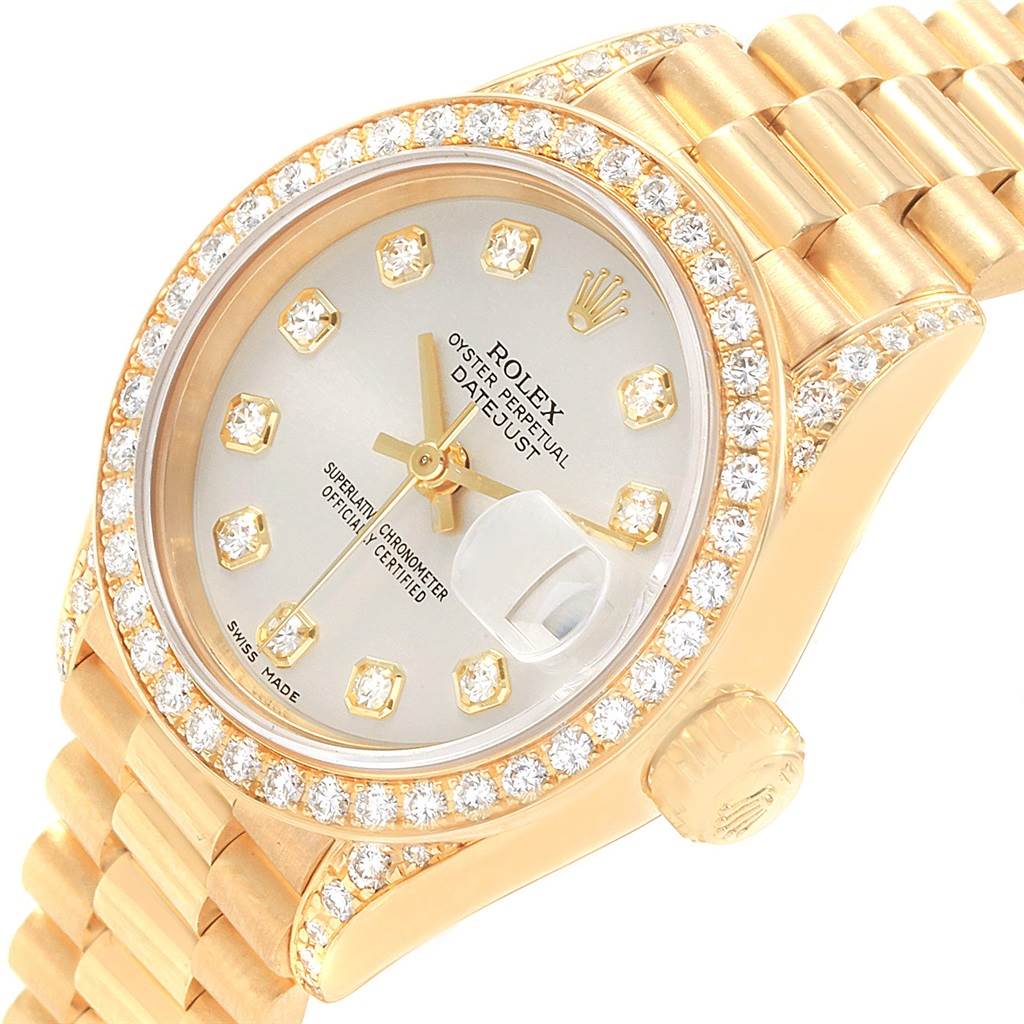 This Rolex President 69158 Women's Yellow Gold Silver Dial 69158 Women's Yellow Gold Silver Dial model watch is shown from an angled side view, featuring the dial, bezel, part of the bracelet, and crown.