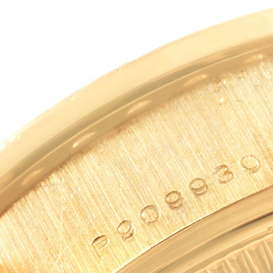 The image shows a close-up of the edge and serial number engraving on a Rolex President 79138 Women's Yellow Gold Champagne Dial 79138 Women's Yellow Gold Champagne Dial watch.