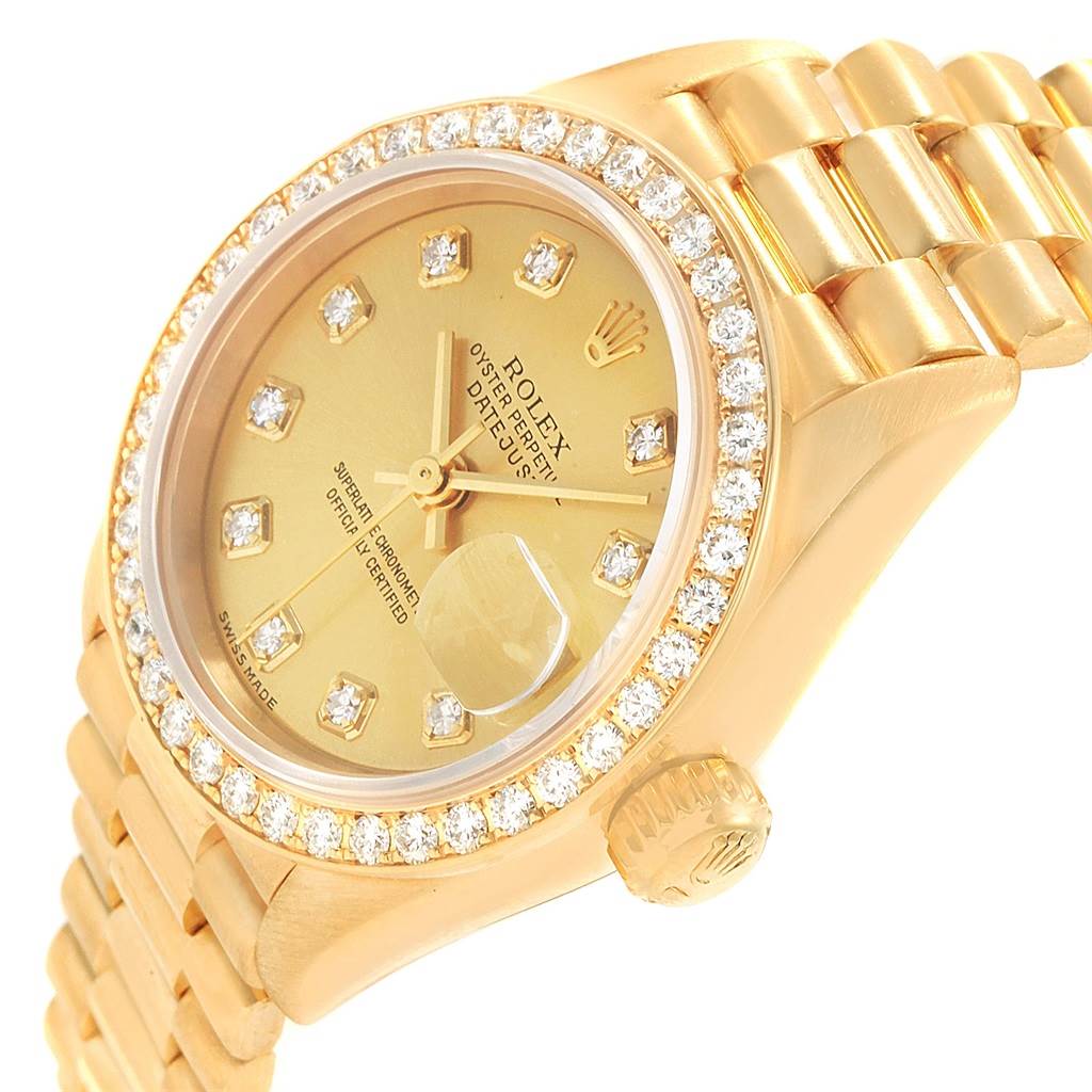 This image shows a close-up angled view of the Rolex President 79138 Women's Yellow Gold Champagne Dial 79138 Women's Yellow Gold Champagne Dial model watch face, bracelet, bezel, and crown.