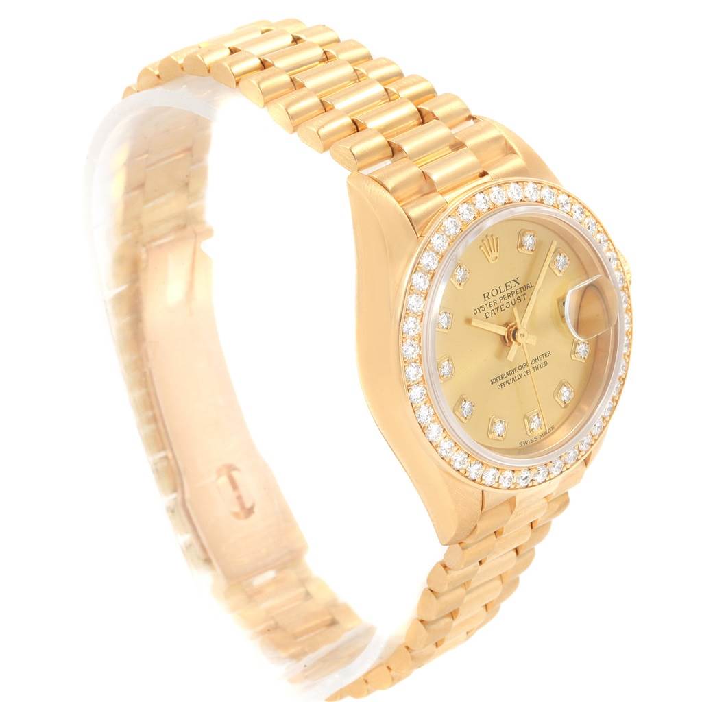 The image shows a side angle of a Rolex President 79138 Women's Yellow Gold Champagne Dial 79138 Women's Yellow Gold Champagne Dial model watch, highlighting its gold band, diamond bezel, and dial.