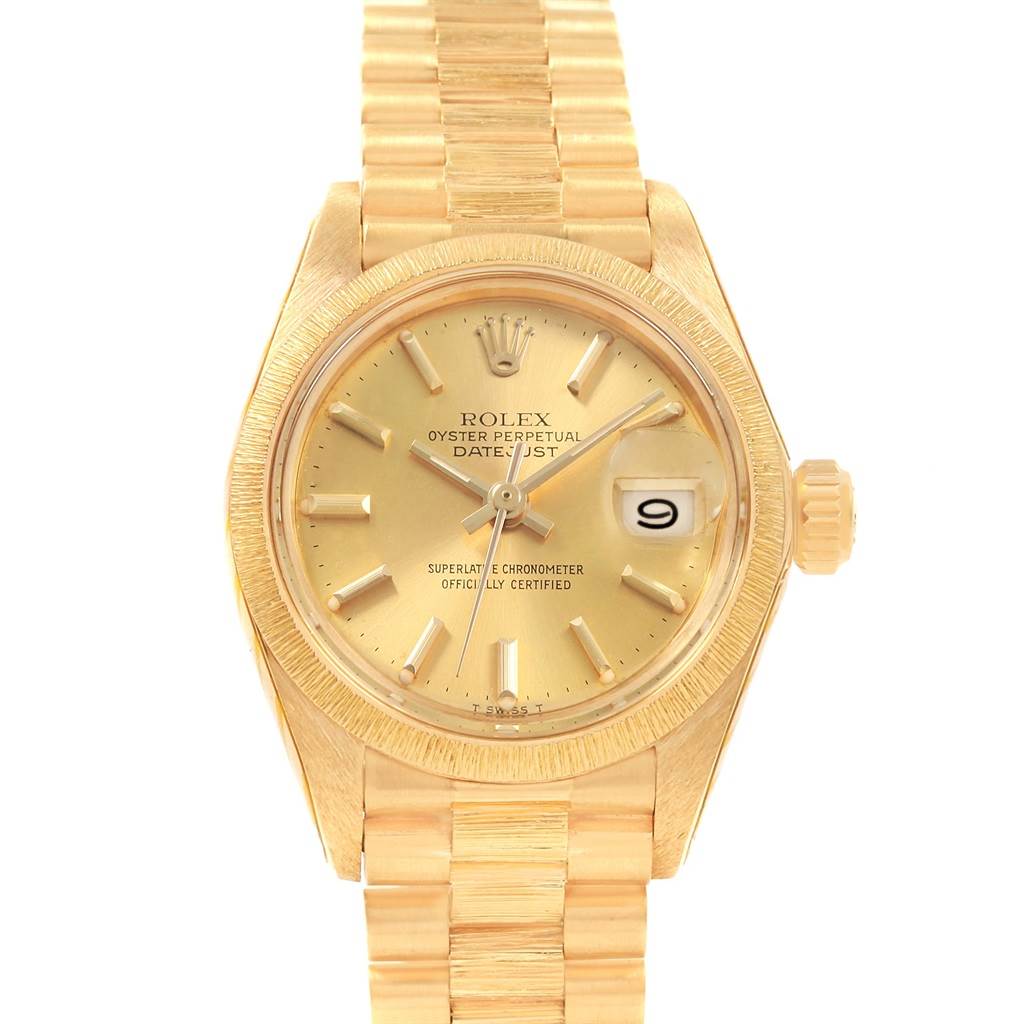 A Rolex President 6927 Women's Yellow Gold Champagne Dial 6927 Women's Yellow Gold Champagne Dial model watch is shown from the front, displaying its gold dial, hands, date, and bracelet.
