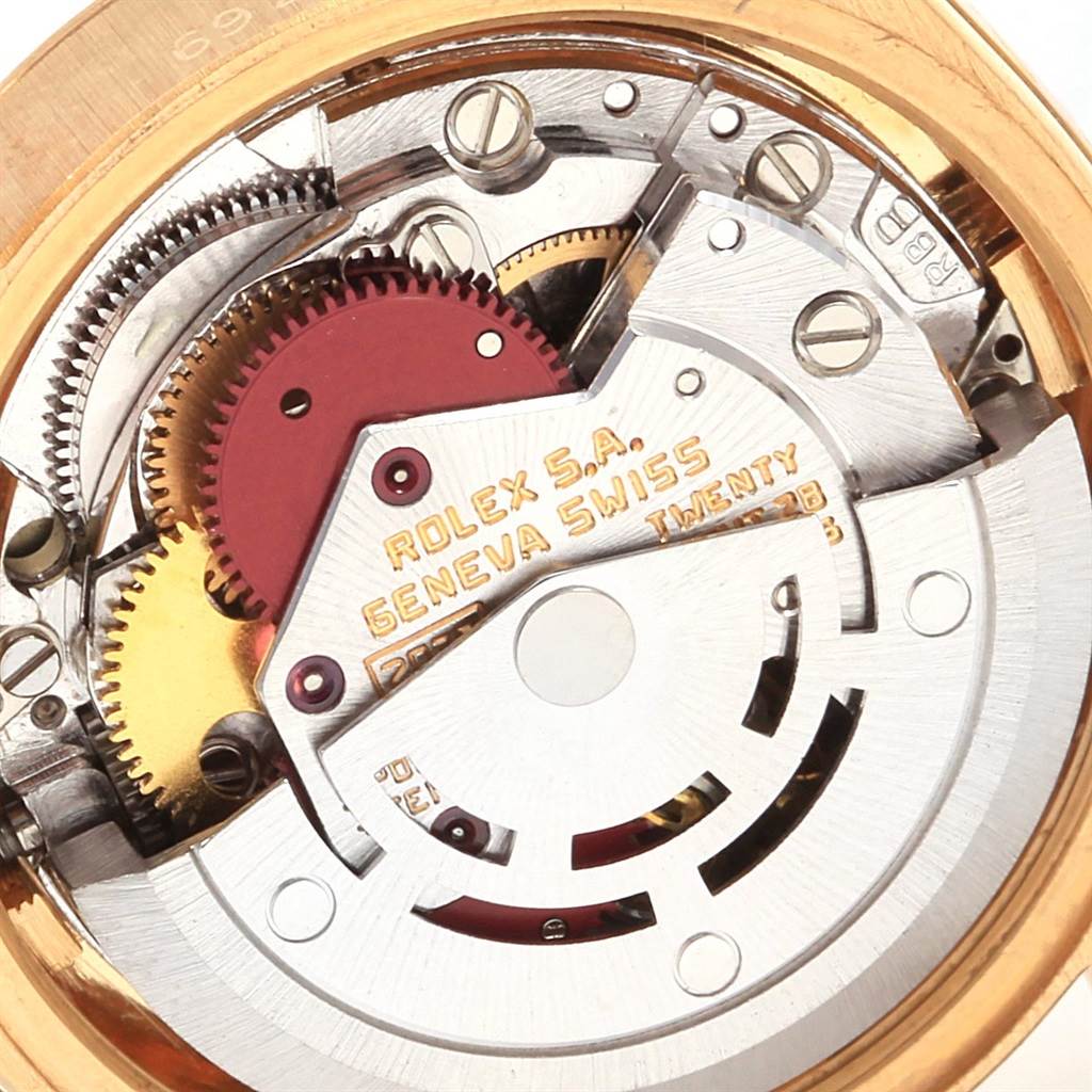This close-up image shows the intricate movement mechanism of the Rolex President 6927 Women's Yellow Gold Champagne Dial 6927 Women's Yellow Gold Champagne Dial model's watch.