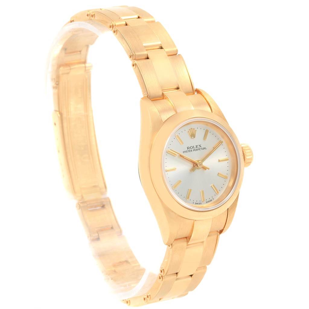 The image shows a President model Rolex watch, highlighting its gold case, bracelet, and dial from a front angle.