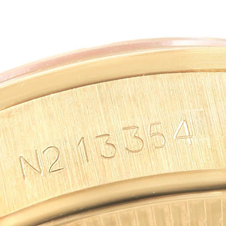 The image shows a close-up angle of the serial number engraved on the case back of a Rolex President 67188 Women's Yellow Gold Silver Dial 67188 Women's Yellow Gold Silver Dial model watch.