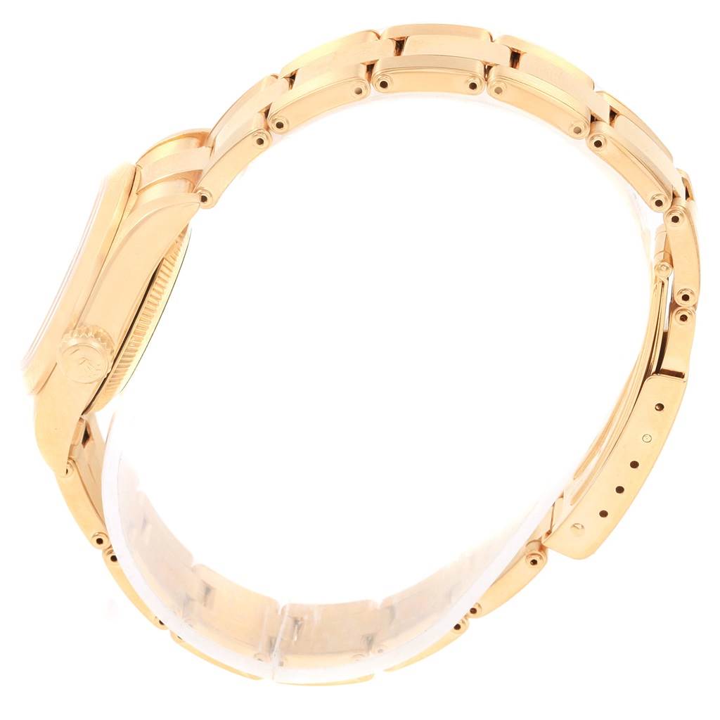 The image shows a side view of a Rolex President 67188 Women's Yellow Gold Silver Dial 67188 Women's Yellow Gold Silver Dial model watch focusing on the gold bracelet and case.