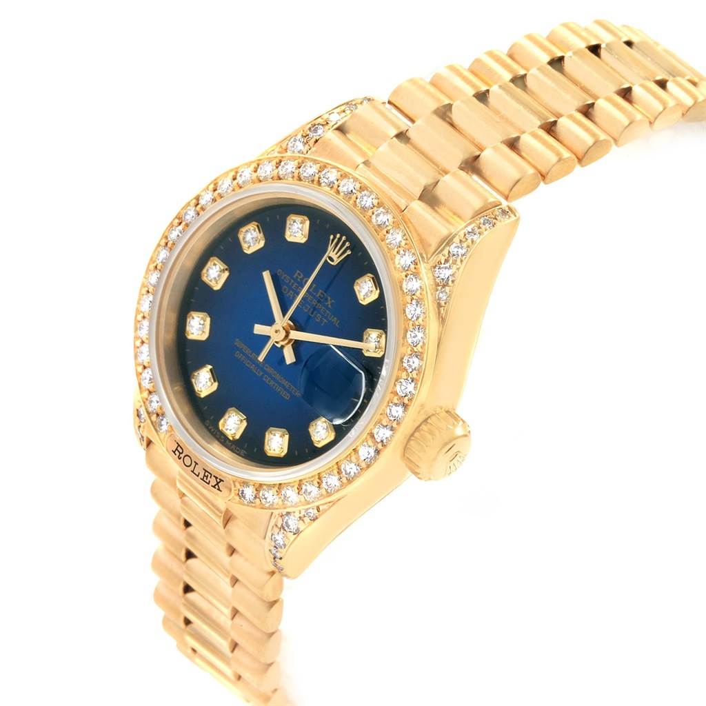 The image shows a Rolex President 69158 Women's Yellow Gold Blue Dial 69158 Women's Yellow Gold Blue Dial model watch angled from the front-left, showcasing its bracelet, bezel, and dial.