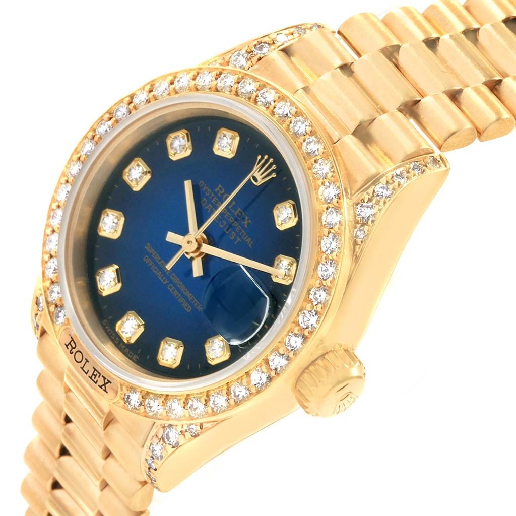 The image shows a close-up of a Rolex President 69158 Women's Yellow Gold Blue Dial 69158 Women's Yellow Gold Blue Dial watch, highlighting the dial, bezel, crown, and part of the bracelet.
