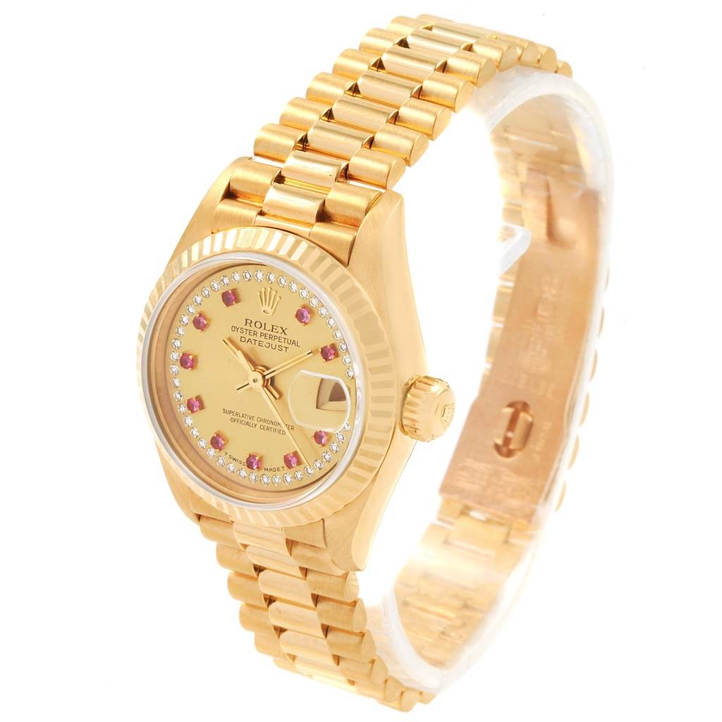 The image shows a Rolex President 69178 Women
s Yellow Gold Champagne Dial 69178 Women
s Yellow Gold Champagne Dial model watch from an angled top view, displaying its dial, bezel, and bracelet.