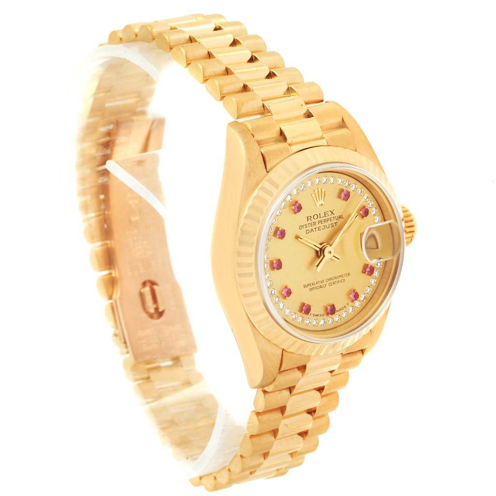 The image shows a side angle of a Rolex President 69178 Women
s Yellow Gold Champagne Dial 69178 Women
s Yellow Gold Champagne Dial model watch, featuring its gold bracelet, face, and fluted bezel.