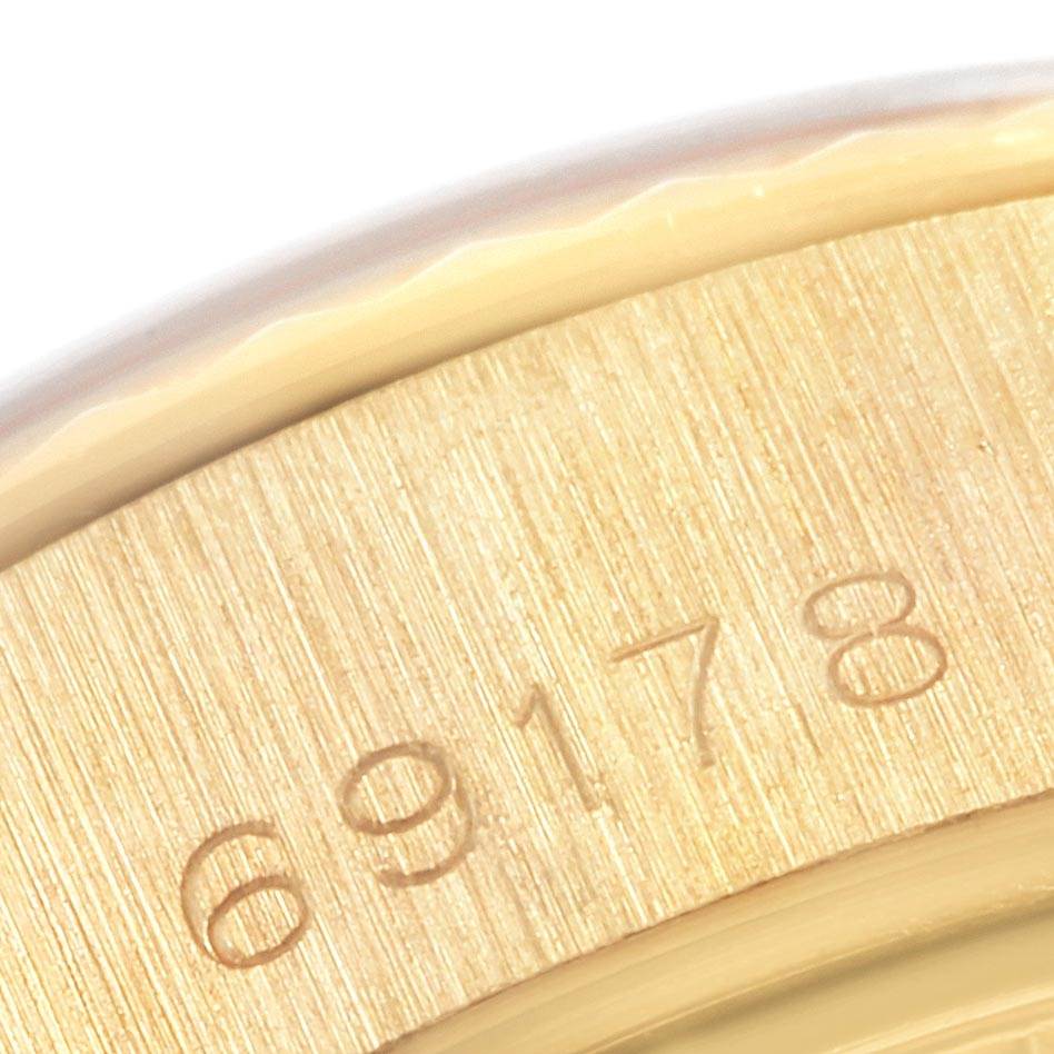 This close-up shot shows the engraved reference number "69178" on the case of a Rolex President 69178 Women
s Yellow Gold Mother of Pearl Dial 69178 Women
s Yellow Gold Mother of Pearl Dial model watch.