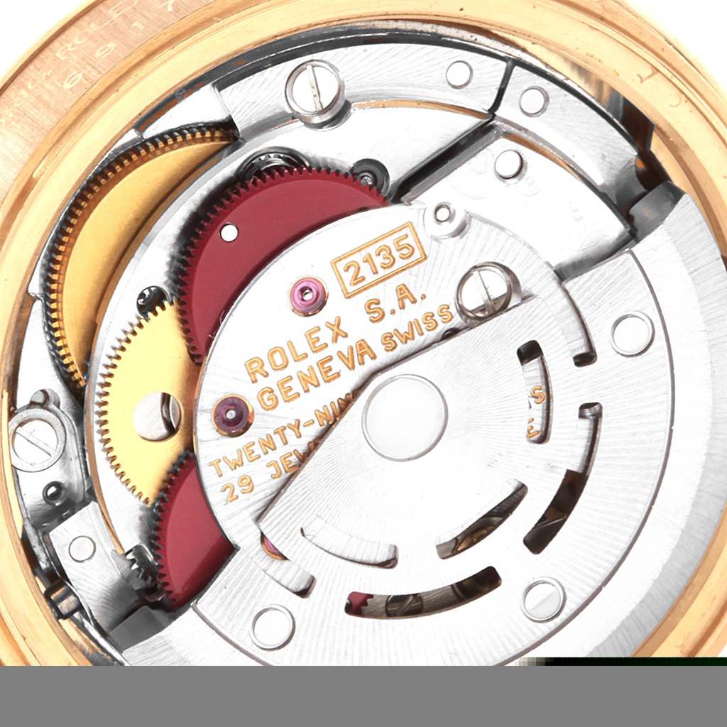 Close-up view of the movement inside the Rolex President 69178 Women
s Yellow Gold Mother of Pearl Dial 69178 Women
s Yellow Gold Mother of Pearl Dial model, showcasing gears and internal components.