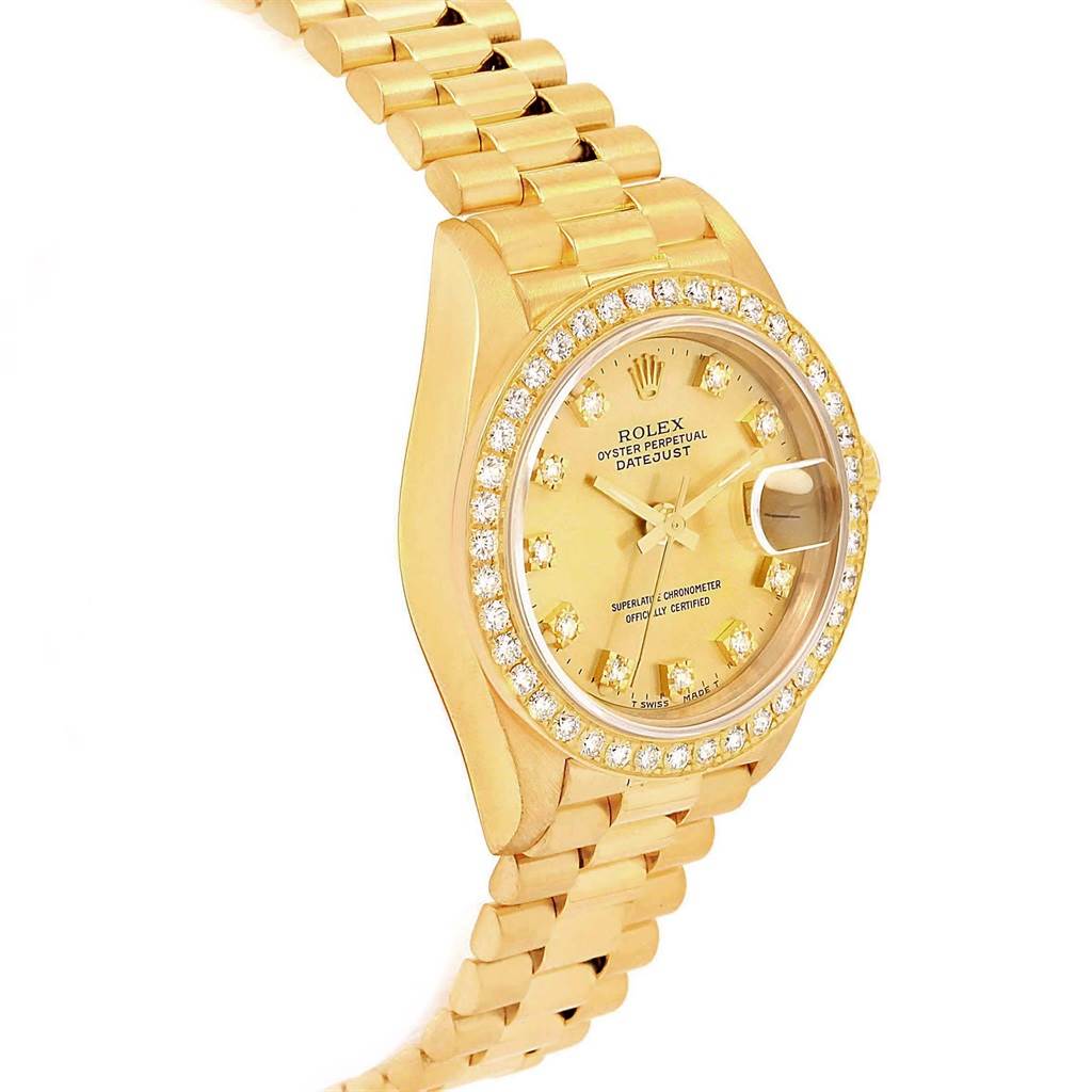 The image shows a Rolex President 69178 Women
s Yellow Gold Champagne Dial 69178 Women
s Yellow Gold Champagne Dial model watch with a gold case, diamond bezel, and gold bracelet at a slight angle.