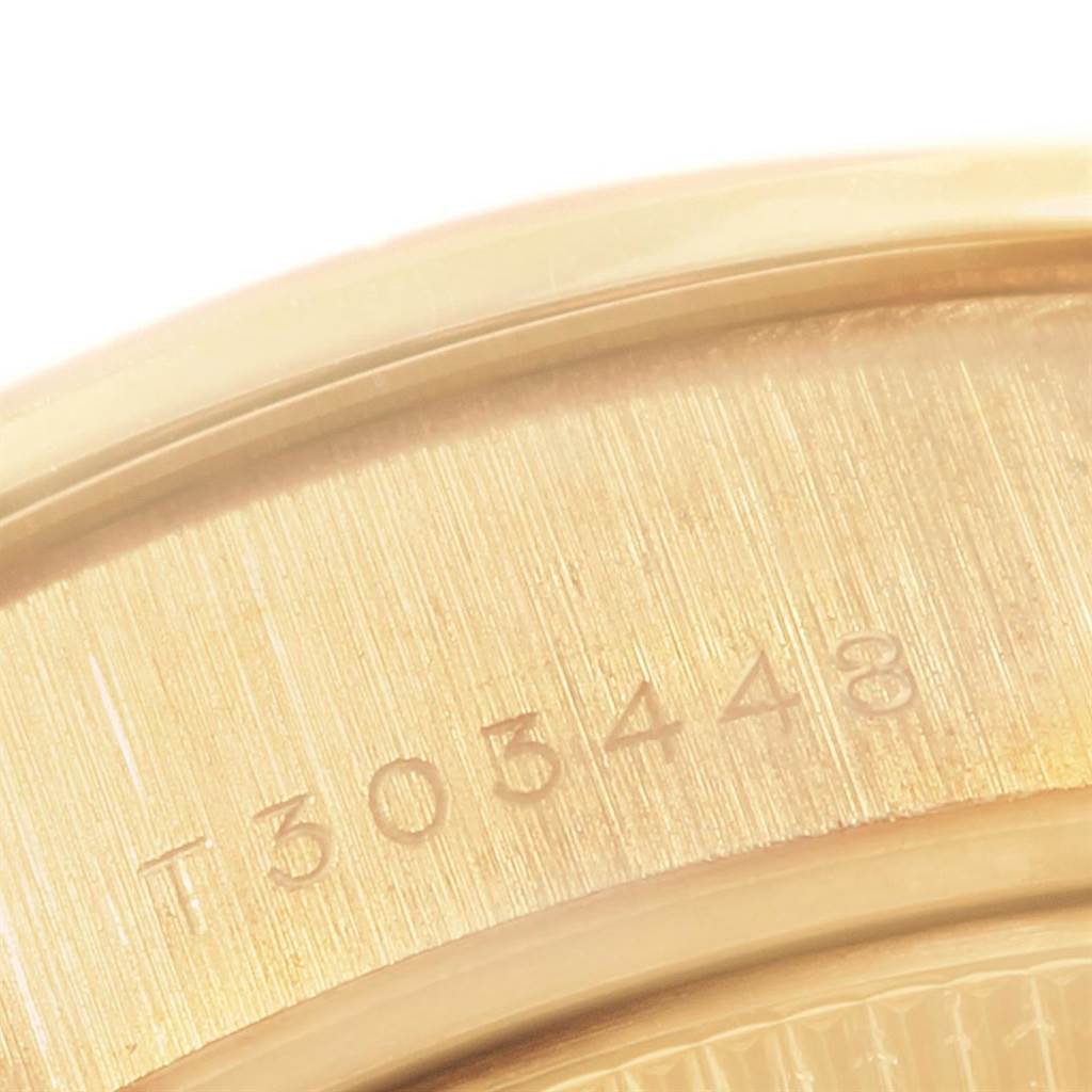 The image shows the serial number engraving on the case back of the Rolex President 69178 Women
s Yellow Gold Champagne Dial 69178 Women
s Yellow Gold Champagne Dial model watch.