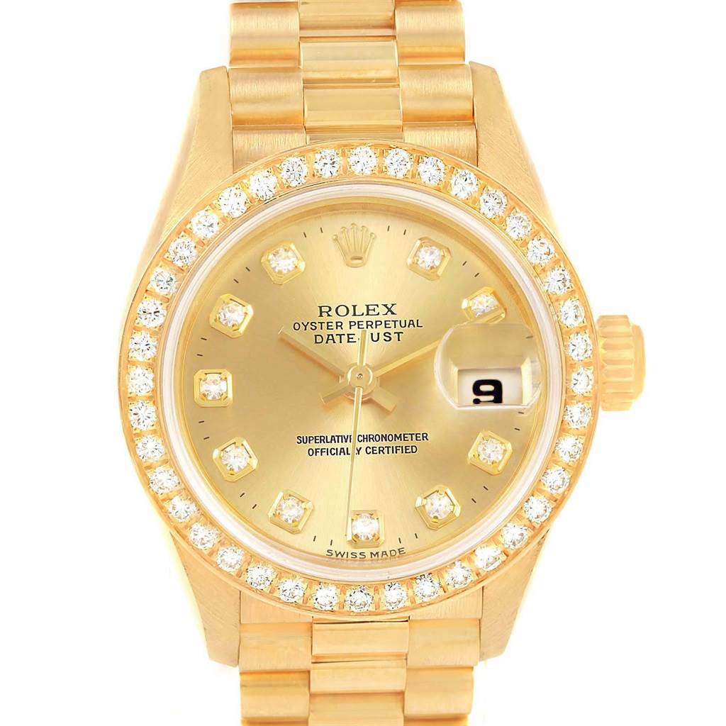 This image shows a front view of a Rolex President 79138 Women's Yellow Gold Champagne Dial 79138 Women's Yellow Gold Champagne Dial model watch, highlighting its gold finish, diamond-set bezel, and date window.