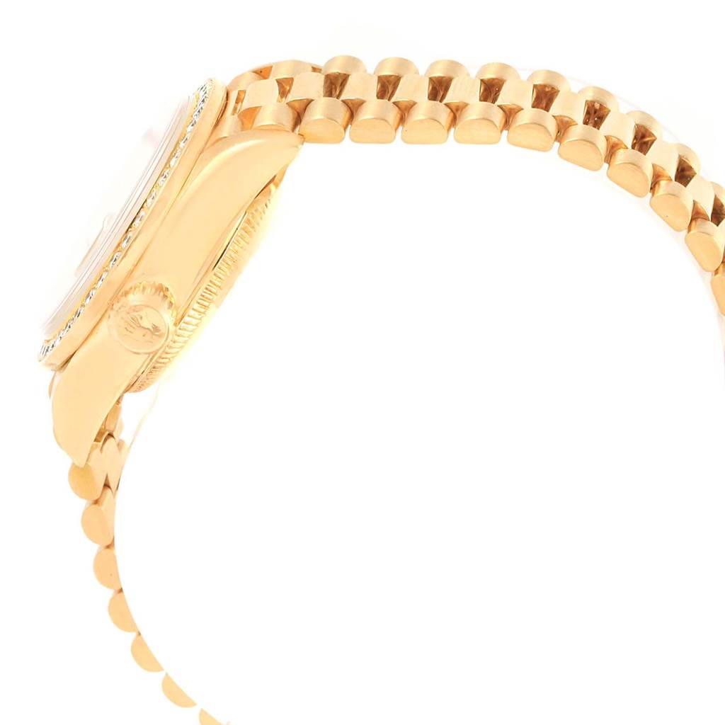 The image shows a side view of a Rolex President 79138 Women's Yellow Gold Champagne Dial 79138 Women's Yellow Gold Champagne Dial watch case and bracelet, highlighting the crown and links.