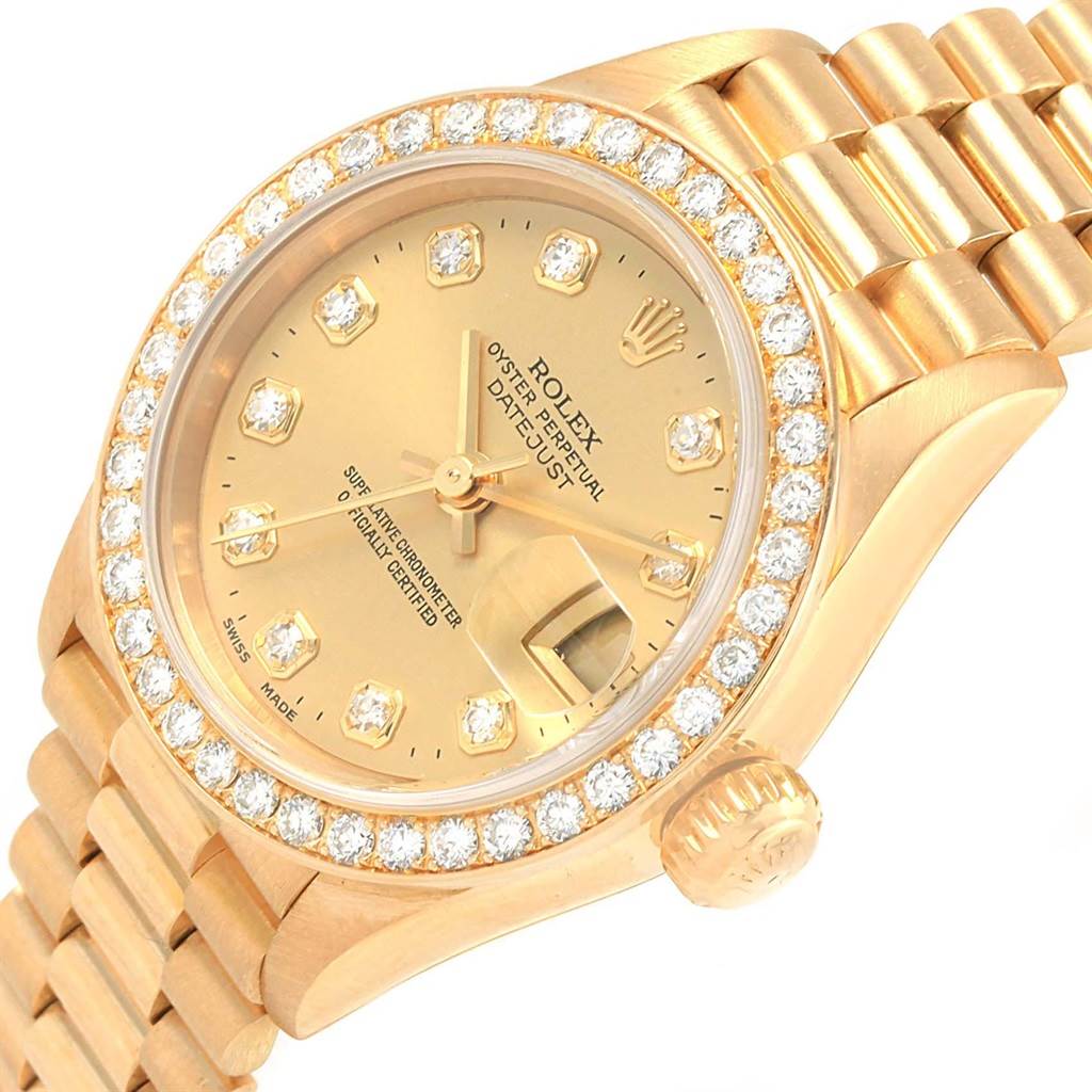 The image shows a Rolex President 79138 Women's Yellow Gold Champagne Dial 79138 Women's Yellow Gold Champagne Dial model watch at an angle highlighting its dial, crown, bezel, and bracelet.