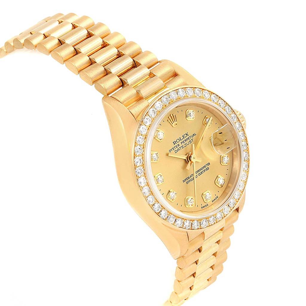 The image shows a Rolex President 79138 Women's Yellow Gold Champagne Dial 79138 Women's Yellow Gold Champagne Dial model watch angled to display the face, bezel, and part of the bracelet.