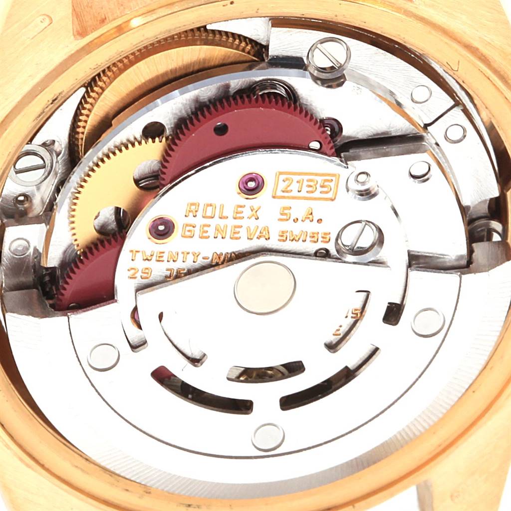 The image shows the movement mechanism from the back of a Rolex President 69178 Women's Yellow Gold Champagne Dial 69178 Women's Yellow Gold Champagne Dial model watch, highlighting gears and plates.