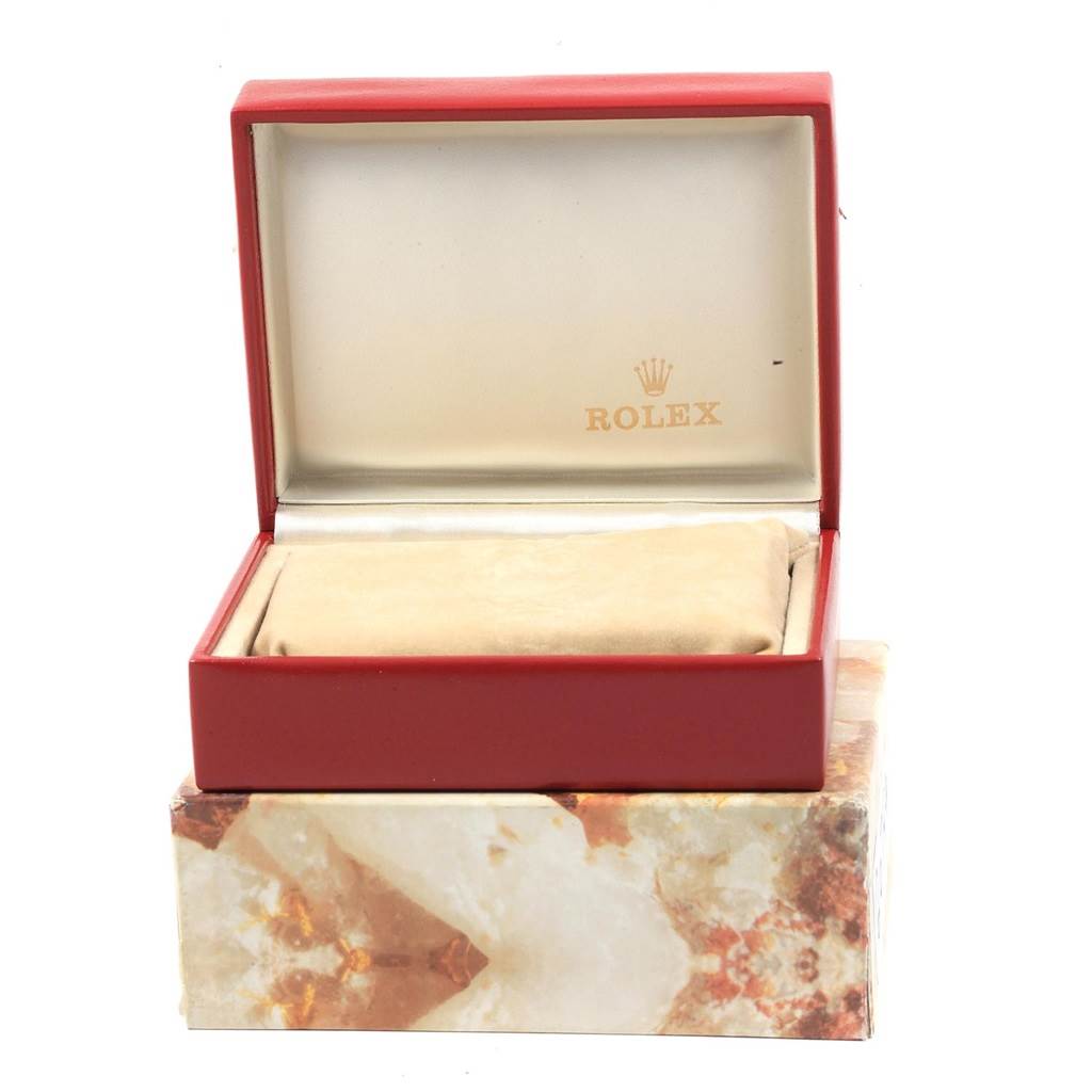 The image shows an open Rolex President 69178 Women's Yellow Gold White Dial 69178 Women's Yellow Gold White Dial model watch box from a front angle, revealing the cushion and the Rolex logo inside the lid.