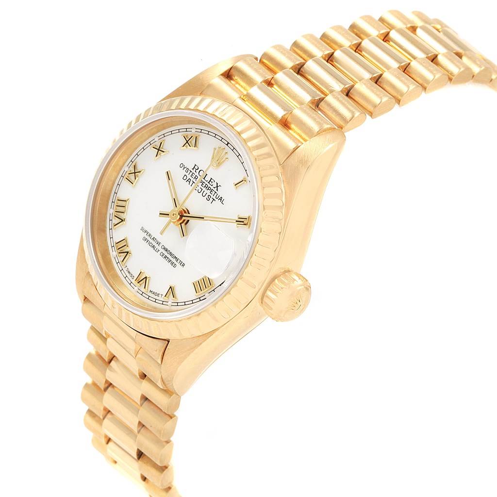 The image shows a Rolex President 69178 Women's Yellow Gold White Dial 69178 Women's Yellow Gold White Dial model watch at an angled side view, revealing the face, crown, and part of the bracelet.