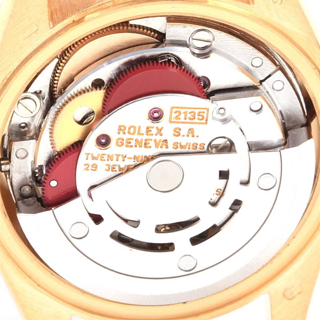 This close-up angle shows the internal mechanism and movement of the Rolex President 69178 Women's Yellow Gold White Dial 69178 Women's Yellow Gold White Dial model watch.