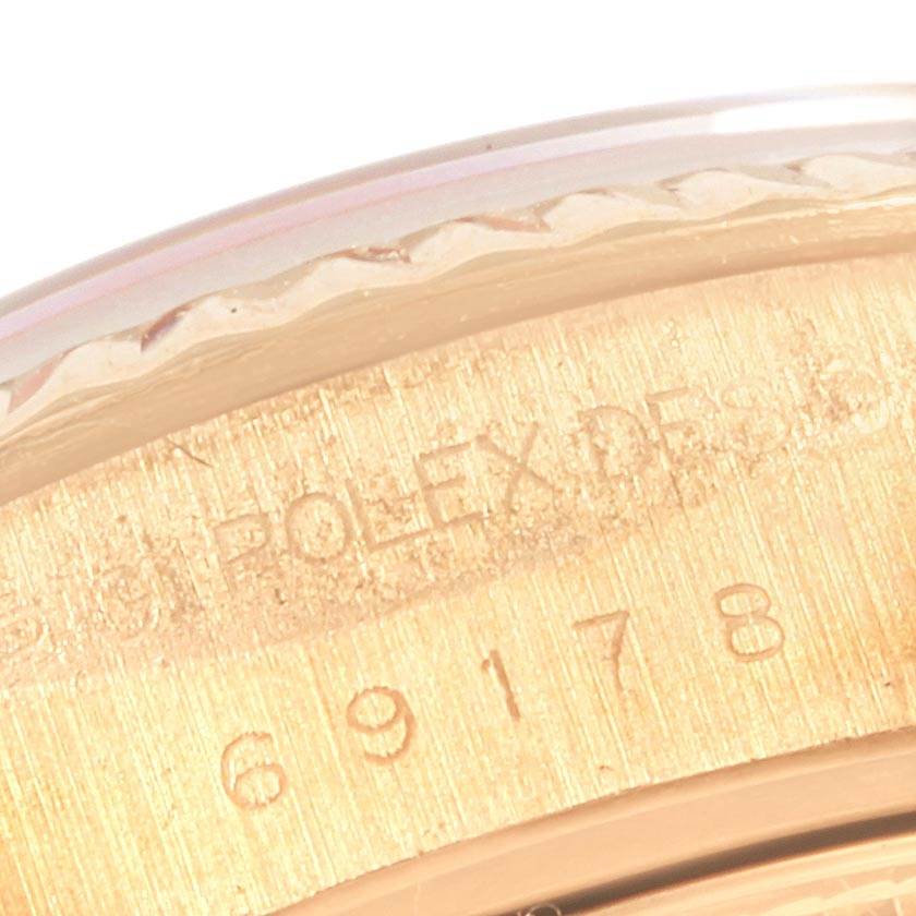 The close-up image shows the engraved serial number on the side of a Rolex President 69178 Women's Yellow Gold White Dial 69178 Women's Yellow Gold White Dial model watch.