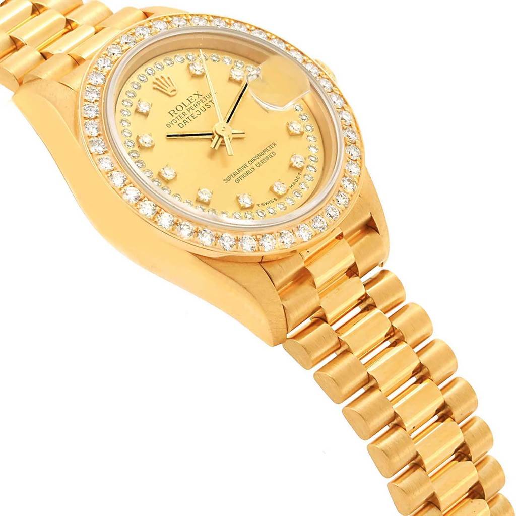 The image shows a side angle of a Rolex President 69138 Women's Yellow Gold Champagne Dial 69138 Women's Yellow Gold Champagne Dial model watch, displaying the dial, bezel, and part of the bracelet.
