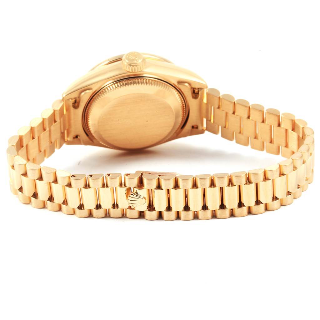 The image shows the back case and bracelet of a Rolex President 69138 Women's Yellow Gold Champagne Dial 69138 Women's Yellow Gold Champagne Dial model watch, viewed from an angled rear perspective.