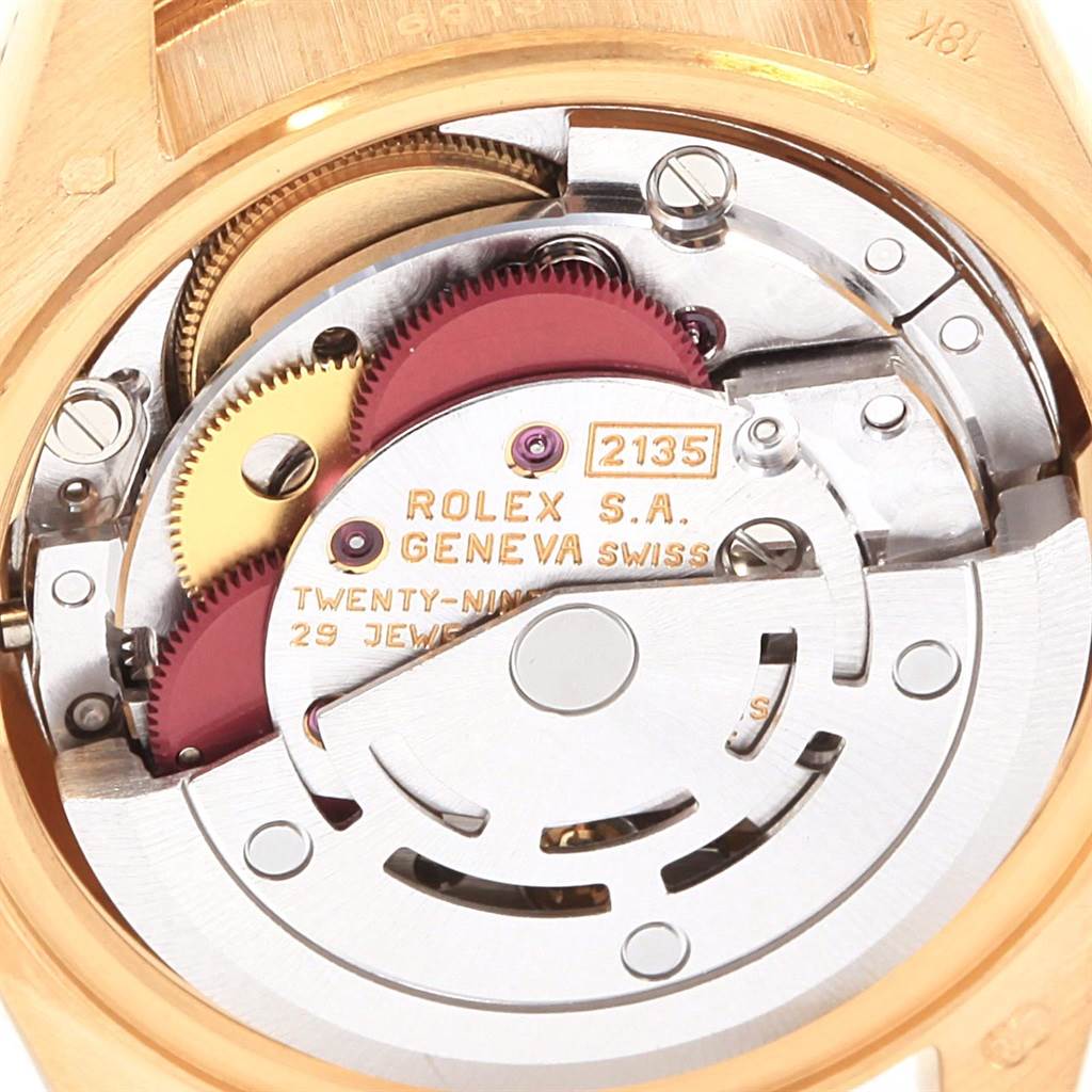 This image shows the intricate inner workings and movement (caliber 2135) of a Rolex President 69138 Women's Yellow Gold Champagne Dial 69138 Women's Yellow Gold Champagne Dial model watch from a close-up angle.
