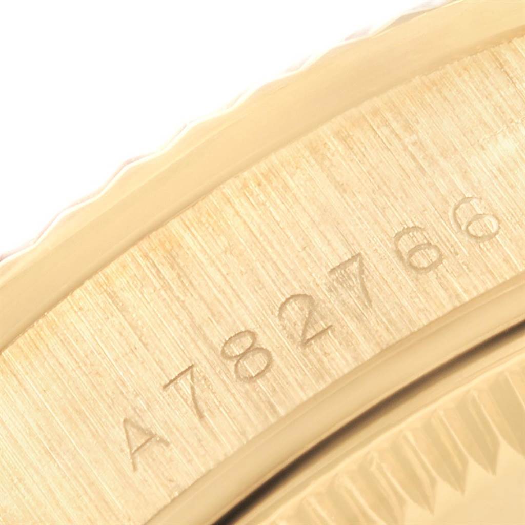 This is a close-up of the serial number engraving on the gold case of a Rolex President 78278 Women
s Yellow Gold White Dial 78278 Women
s Yellow Gold White Dial model watch.
