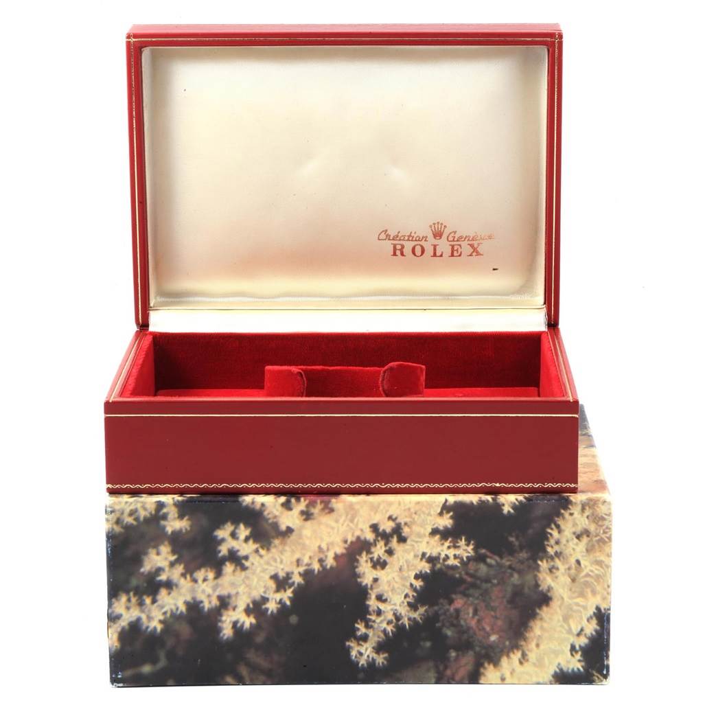 An open, empty red and beige Rolex President 78278 Women
s Yellow Gold White Dial 78278 Women
s Yellow Gold White Dial model watch box is shown from a direct front angle.