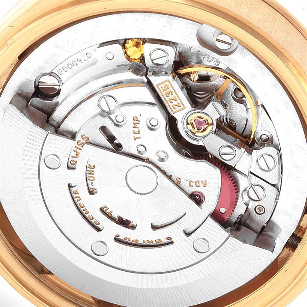 This image shows the intricate movement and internal mechanics of the Rolex President 78278 Women
s Yellow Gold White Dial 78278 Women
s Yellow Gold White Dial model watch from a close-up, top-down angle.