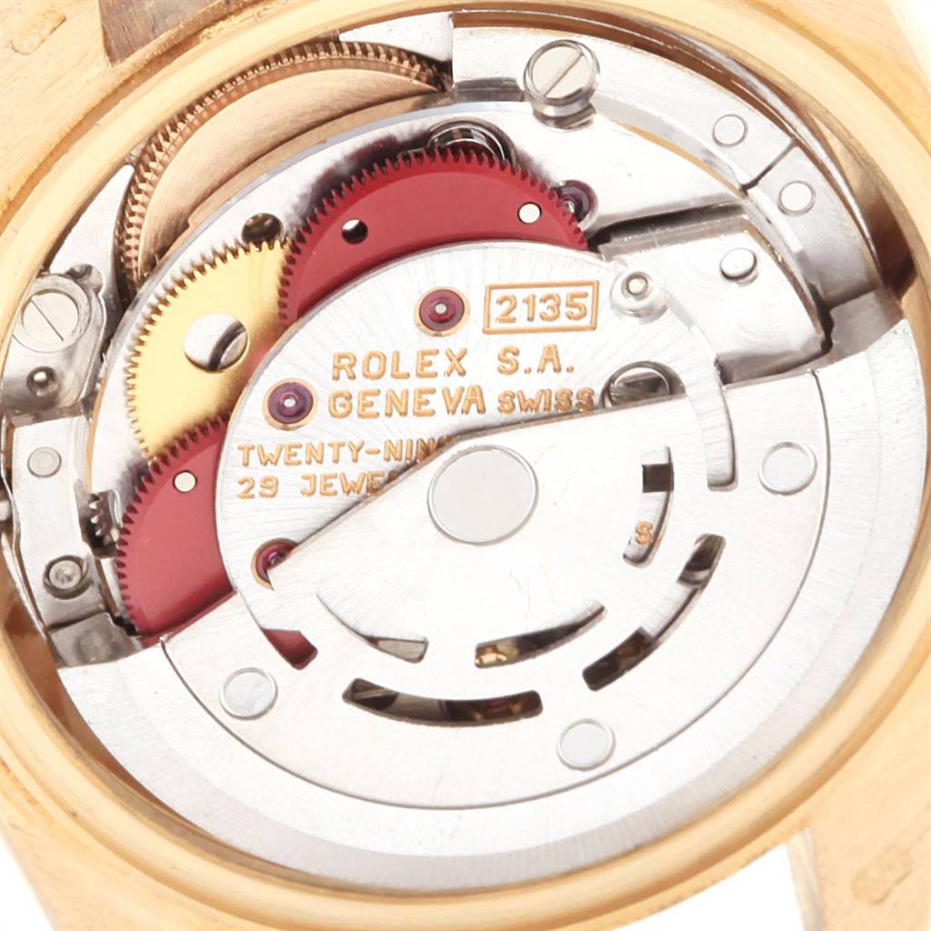 This image shows an up-close view of the movement mechanism of a Rolex President 69178 Women's Yellow Gold Beige Dial 69178 Women's Yellow Gold Beige Dial model.
