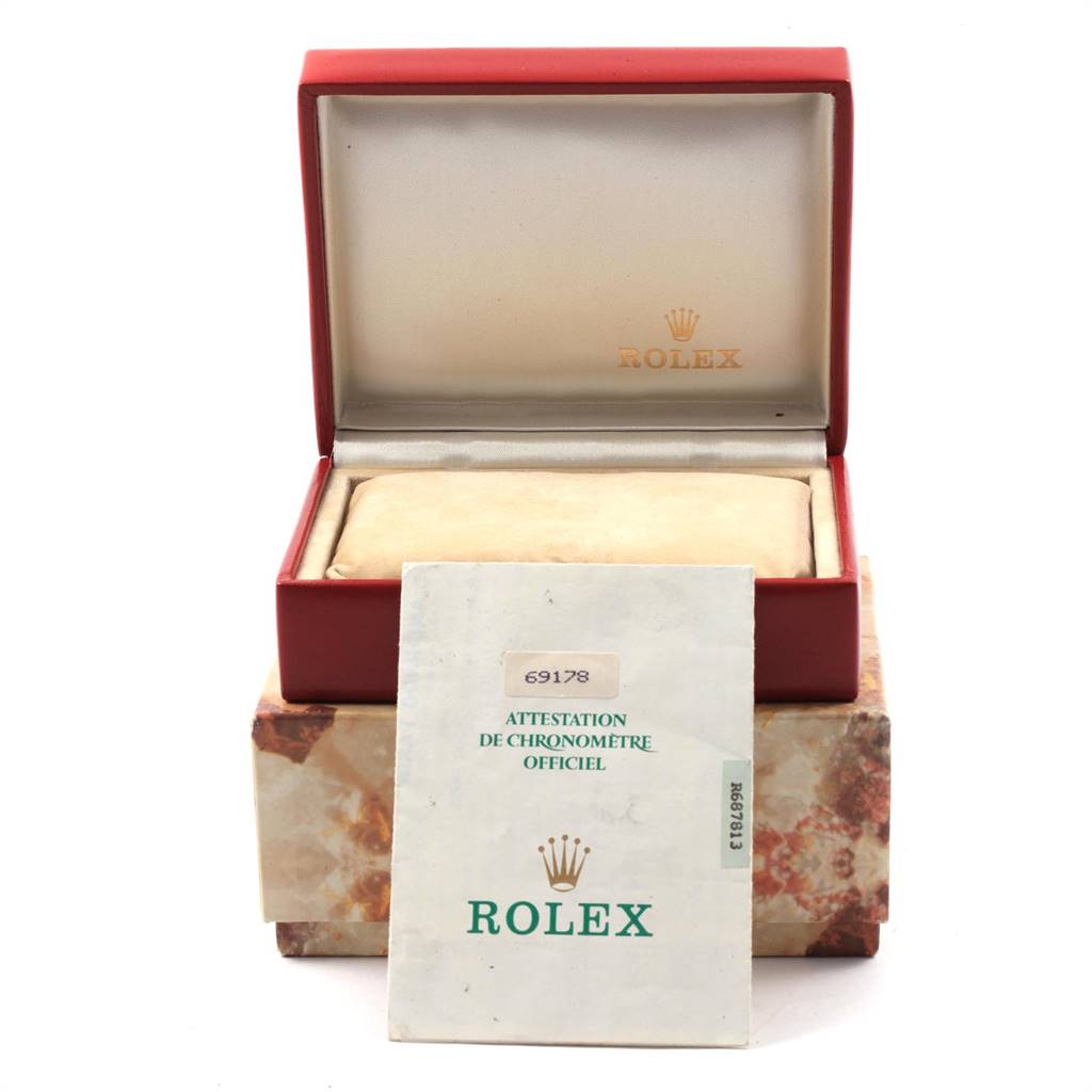 The image shows a Rolex President 69178 Women's Yellow Gold Beige Dial 69178 Women's Yellow Gold Beige Dial model's open red watch box, with an outer box underneath and a certificate in front.