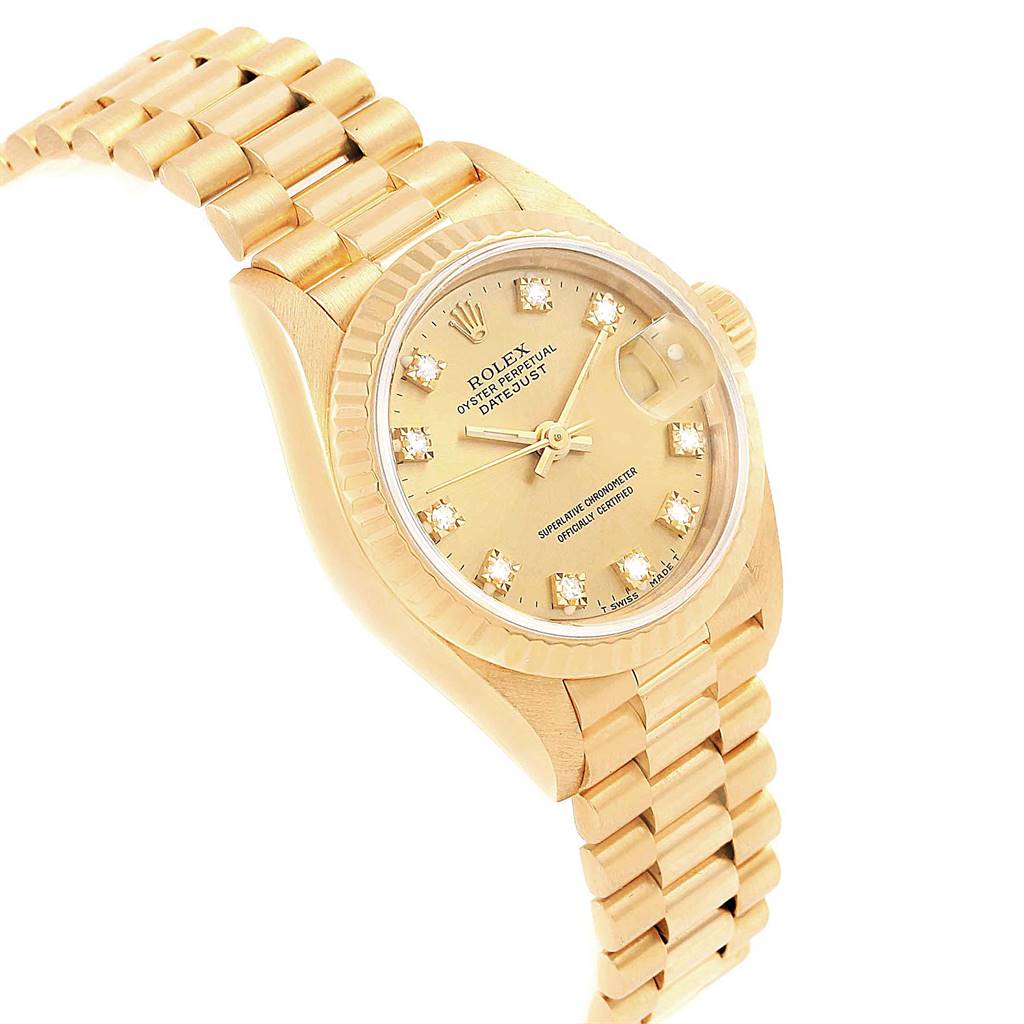 This image shows a Rolex President 69178 Women
s Yellow Gold Champagne Dial 69178 Women
s Yellow Gold Champagne Dial model watch from an angled view, showcasing its dial, case, bezel, and bracelet.